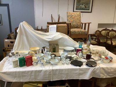 a table with many items on it in a room