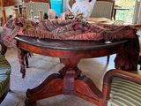 a table with a cloth on it in the middle of a room