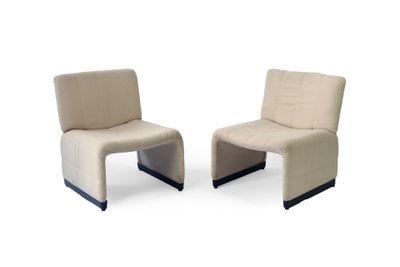 pair of beige chairs with black legs on a white background