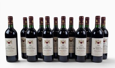 six bottles of wine are lined up in a row on a white surface