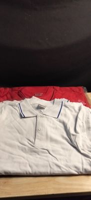 a pile of clothes sitting on top of a wooden table