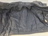an image of a black jacket is laying on a table