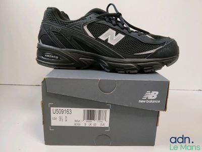 brand new balance shoes in box with price tag on top