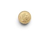 a gold coin with a woman ' s face on it
