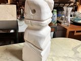 a white sculpture on top of a table in a room
