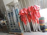 a lot of chairs and umbrellas that are on the ground