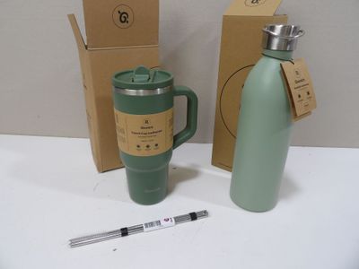 a green coffee mug next to a green water bottle and a pen
