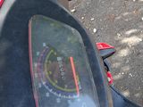 a close up of a motorcycle with a speedometer on the back of it