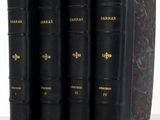 three black books are lined up on top of each other