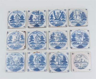 several blue and white tiles with images of people and animals on them