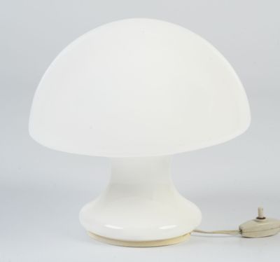 a close up of a white mushroom shaped lamp on a white surface