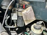 a close up of a car ' s engine with a lot of wires