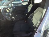 a picture of the inside of a car with the driver ' s seat up