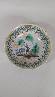 a small plate with a bird on it on a table