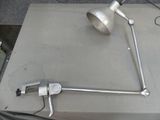 a picture of a table with a lamp and some tools on it