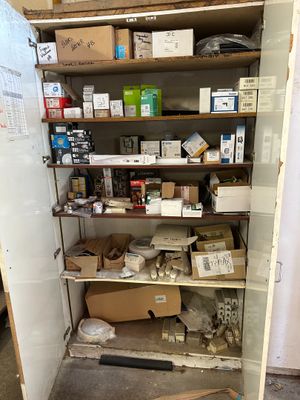 many boxes and boxes on the shelves in the room