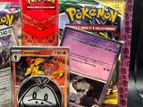 a bag of pokemon cards and a card holder on a table