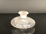 an image of a glass candle holder on a table