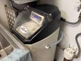 a water heater that is next to a sink