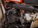 a close up of a motorcycle with a red and black engine