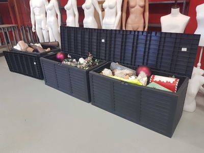 several mannequins are lined up in a row in a clothing store