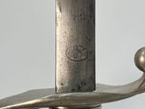a close up of a sword with a metal handle