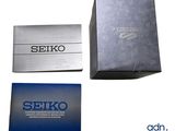 three boxes of seikoo business cards sitting on top of each other