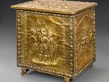 a gold box with a scene of a man and a woman on horseback