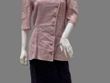 mannequin wearing a pink shirt and black skirt on a white mannequin