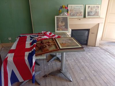 a table with a flag and pictures on it in a room