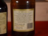 two bottles of wine sitting next to each other on a table