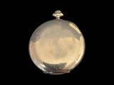 an image of a silver pocket watch on a black background
