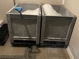 two bins that have snow in them on the floor