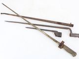three old tools that are sitting on a white surface