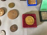 a lot of coins that are sitting on a table