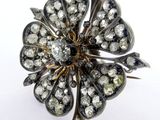 an image of a diamond flower broochle on a white background