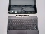 a laptop and a tablet sitting on a table