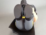 a figurine of a batman sitting on top of a bat