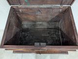 a wooden box that is open on the floor