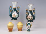 three vases that are sitting next to each other on a table