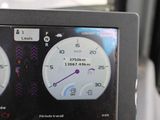 a close up of a car dashboard with various gauges