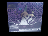 a box of pokemon trading cards on a black background