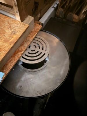 a large metal pan sitting on top of a wooden table
