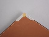 a close up of a piece of paper with a pencil sticking out of it