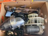 a box full of assorted items including a vacuum