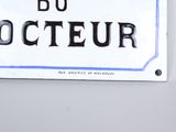 a sign that is hanging on the wall of a building