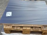 a pallet of wood with a sheet of metal on it