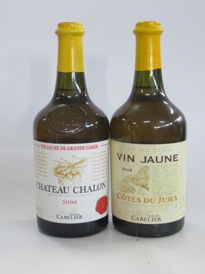 two bottles of wine sitting next to each other on a table