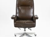 brown leather office chair on casteors on white background