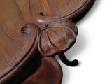 a close up of a wooden table with a clock on it